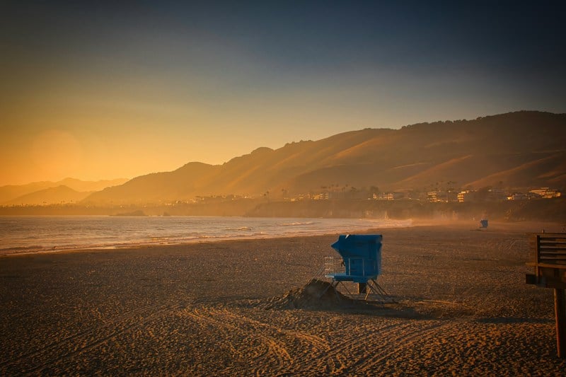 A lifeguard tower at sunset in Pismo Beach, California